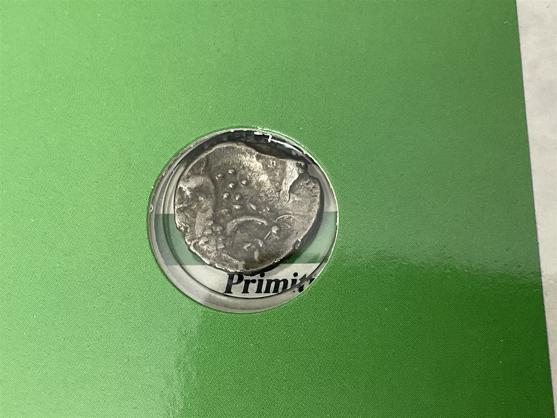 Iceni tribe silver coin, housed in 'The Coinage of Ancient Britain Celtic Coinage of the Iceni Tribe 0-60 A.D.' card presentation folder