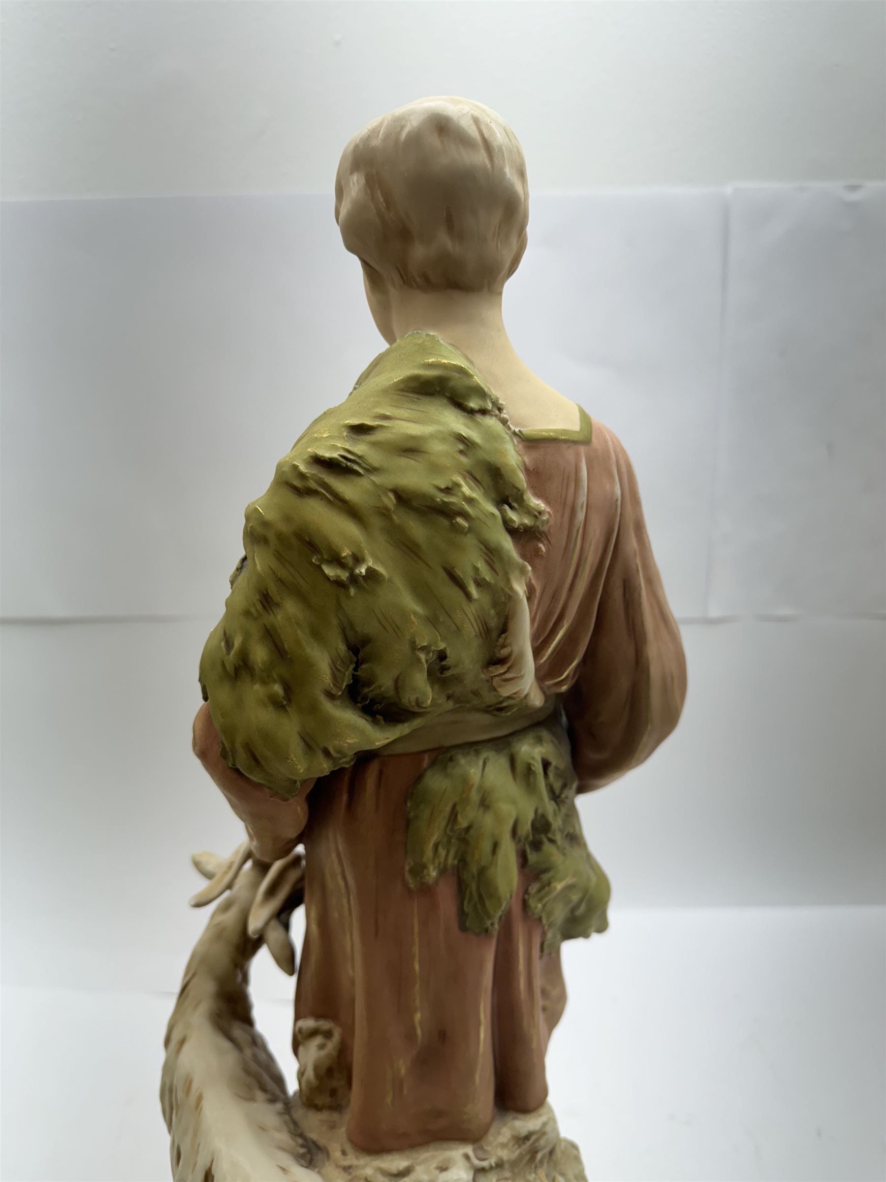 Pair of Royal Dux figures, no. 1115, modelled as a shepherd with a goat by his side and a shepherdess feeding a lamb, each wearing flowing green and pink robes with gilt detailing, with pink triangle mark beneath, H51cm