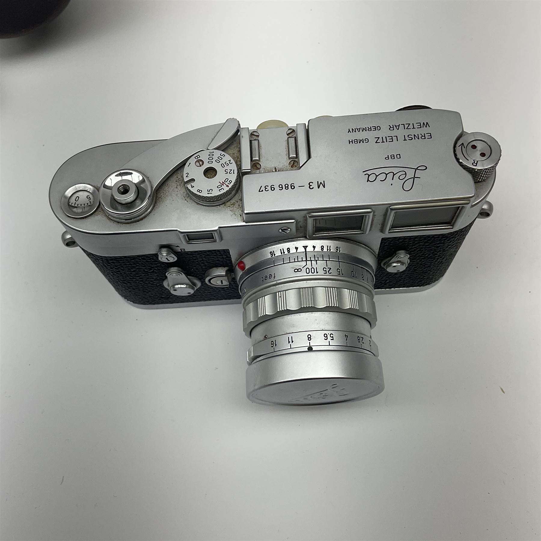 Leica M3 camera body, 1959, chrome finish, serial number '986937', fitted with 'Ernst Leitz GmbH Wetzlar Summicron f=5cm 1:2 Nr.1592614' lens, with Leica M3 instruction booklet