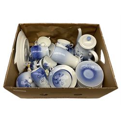  Bing & Grondahl, Copenhagen blue and white Christmas Rose pattern tea wares, to include teapot, covered sucrier, milk jug, fourteen cups and seventeen saucers, etc, together with two Royal Copenhagen collectors plates etc  