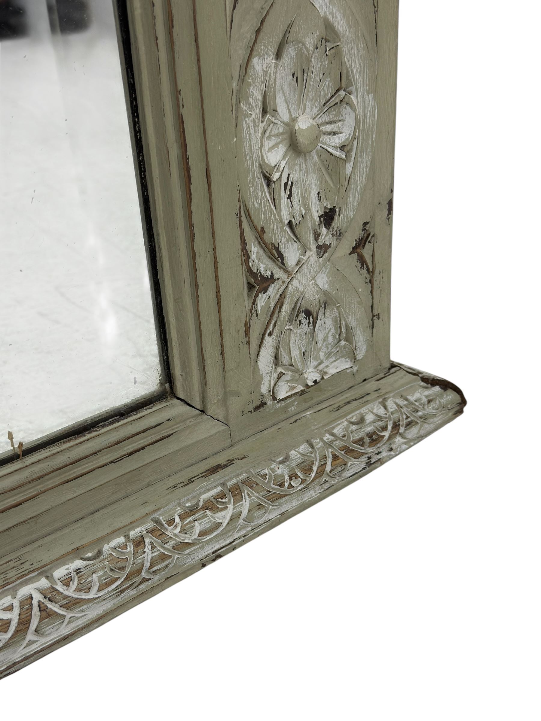 Victorian green and white painted mirror, rectangular bevelled plate within a moulded frame carved in relief with a continuous band of flowerhead roundels, the upper section with stepped cornice and leaf carved frieze  