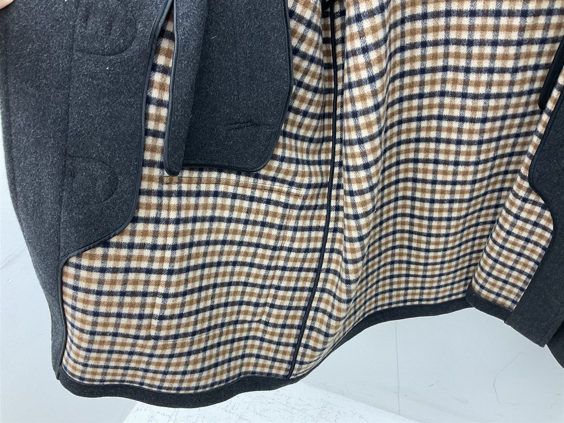 Men's Aquascutum lambs wool herringbone tweed coat with silk lining, 46 Reg, together with a further Men's Aquascutum grey wool duffle coat, with cheque lining and horn buttons, 46