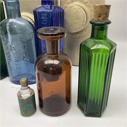 Virol bone marrow stoneware jar, two stoneware hot water bottles and a collection of small apothecary bottles to include amber and green glass examples, some with stoppers and labels, jar H24cm