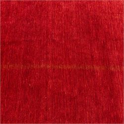 Two contemporary Moroccan Berber hand-woven rugs, deep madder red field of plain design, 199x153cm, other with deep madder red field with a simple lattice of ivory lines forming panels with some tonal variation, 190x146cm 