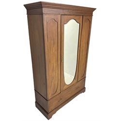 Edwardian figured mahogany and satinwood banded wardrobe, enclosed by shield shaped bevelled mirror door, flanked by panelled uprights, drawer to base, on bracket feet 