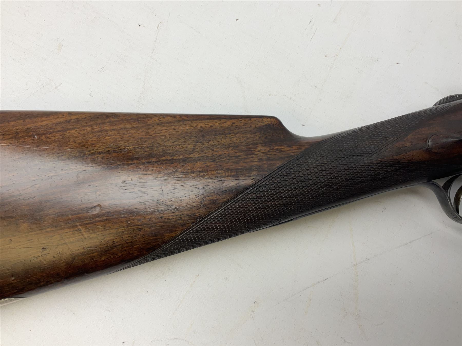Smith Midgley Bradford 12-bore side-by-side double barrel side-lock ejector shotgun with 71cm barrels, engraved action with patented top lever, ivy leaf fences and top safety, walnut stock with chequered grip and fore-end, serial no.62409 to barrels and 1481 to action, L115cm overall SHOTGUN CERTIFICATE REQUIRED