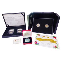 The Channel Islands Liberation '75th Anniversary Proof Pair' of coloured fifty pence coins, 'UK 75th Anniversary of the Normandy Landings DateStamp Pair' fifty pence and two pound coin, and Pobjoy Mint 2014 'Dolphin' turquoise titanium coin, all cased with certificates