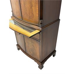 Georgian design mahogany cocktail cabinet, fitted with cupboard enclosing mirror back and single glass shelf, over brushing slide with mirrored plate and two cupboard doors, flanked by fluted uprights
