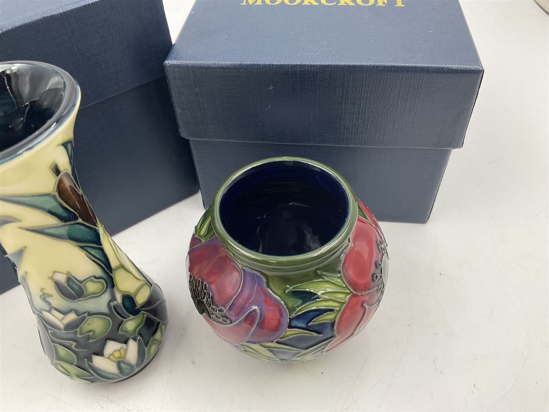 Two small Moorcroft vases, one decorated in the Lamia pattern by Rachel Bison, circa 1995, H13cm and the other in the Anemone Tribute pattern by Emma Bossons, circa 2002, H7.5cm, both with original boxes (2)