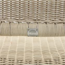 Kok Maison - 20th century French wicker chairs, set of eight including two carvers, with arched woven backs and seats in close cane weave, the frames painted cream, the arms with wrapped wicker detail, raised on turned supports united by cross shaped stretchers