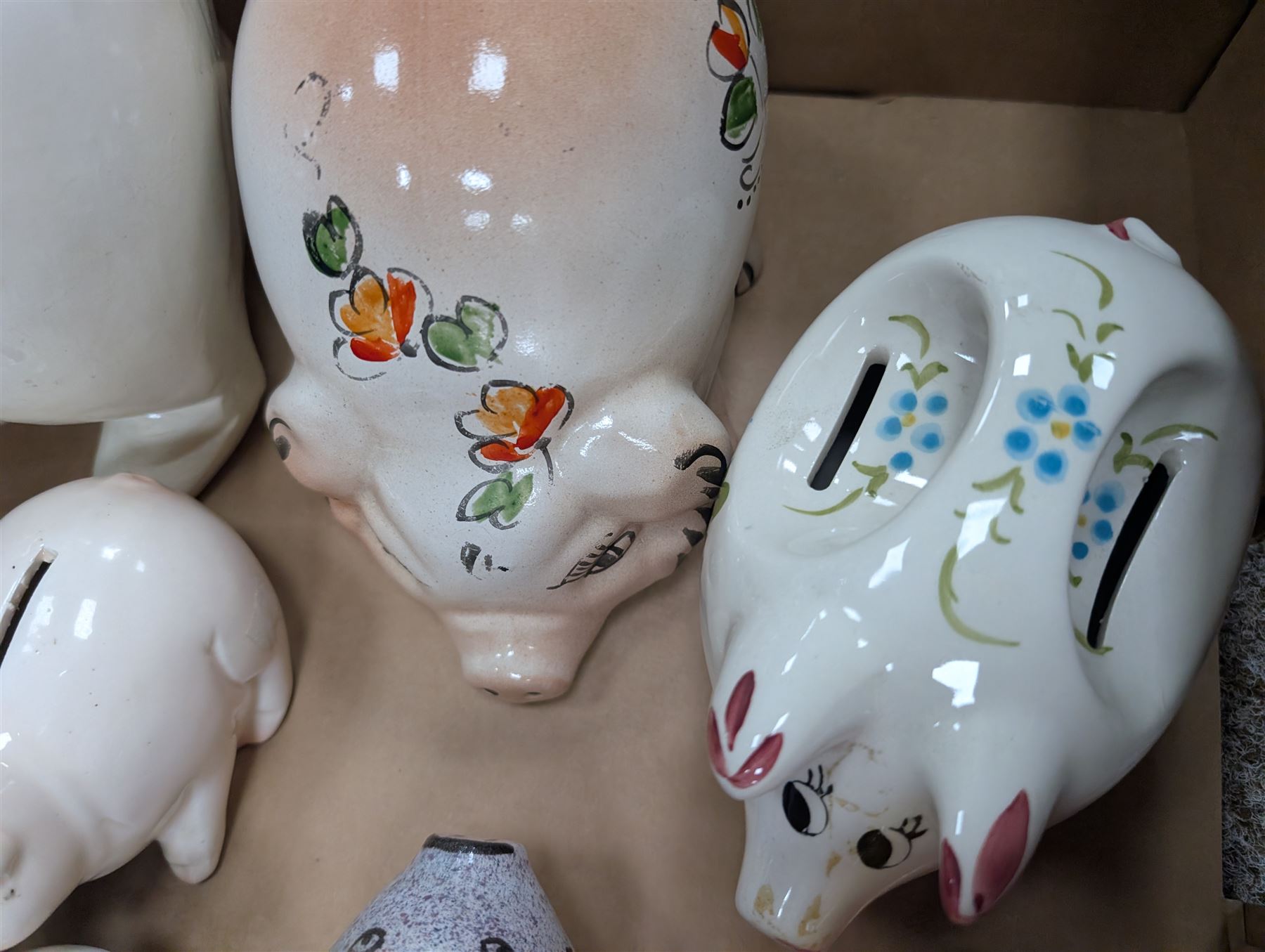 Collection of ten Vintage pottery piggy banks, to include treacle glaze example, H10.5cm, largest H18cm