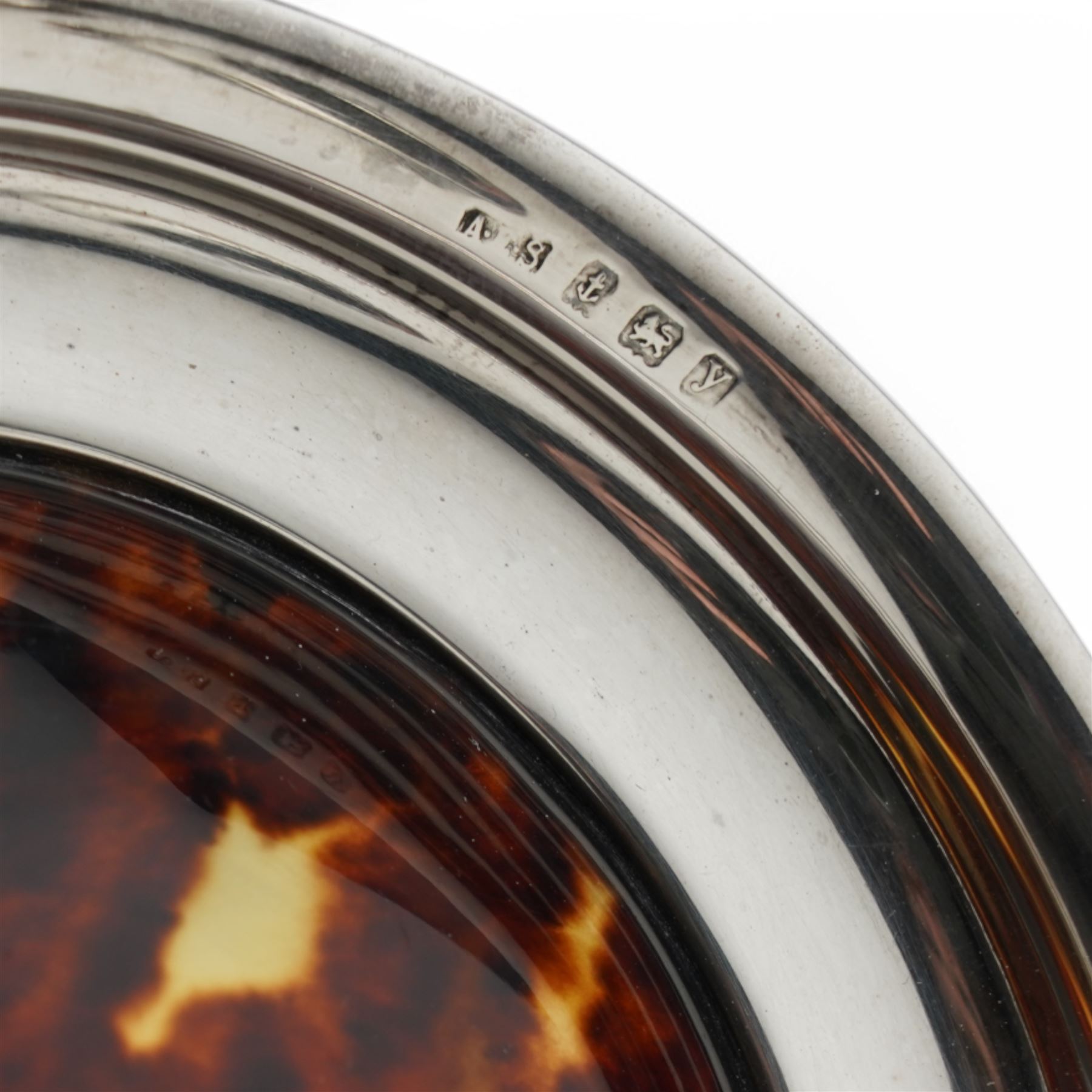 Silver Armada style dish D12cm in Barbara Cattle box London 1974, small silver circular photograph frame London 1914 Maker William Comyns, another small frame and a silver and tortoiseshell pin dish (4)