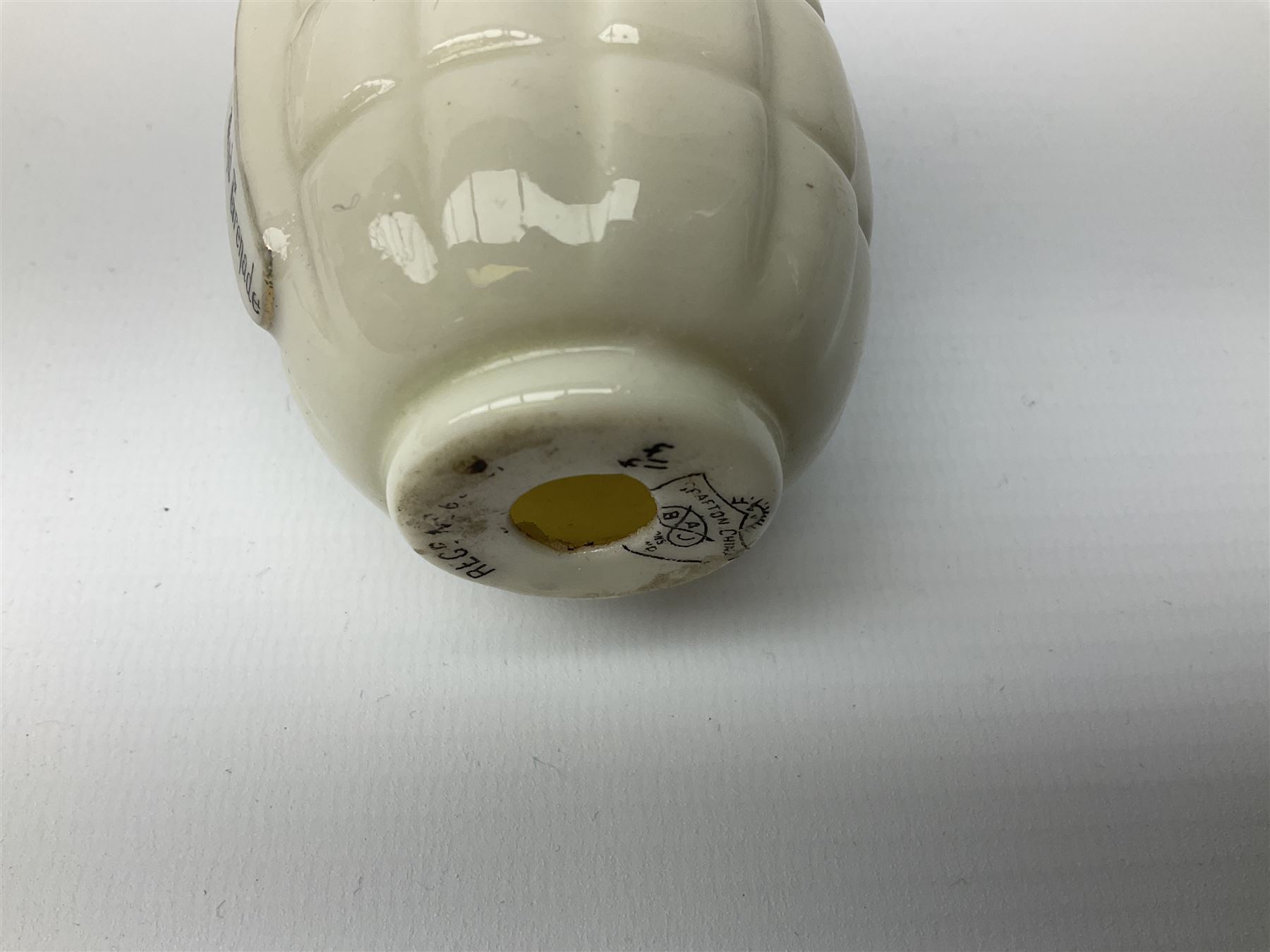 Three pieces of crested ware, comprising grenade detailed 'The Mills Hand Grenade' with Filey Crest, marked beneath Grafton China, a cannon with crest banner detailed 'Sterlini Oppidvm', marked beneath W H Goss, and a submarine with Tunbridge Wells crest, marked beneath Arcadian China 