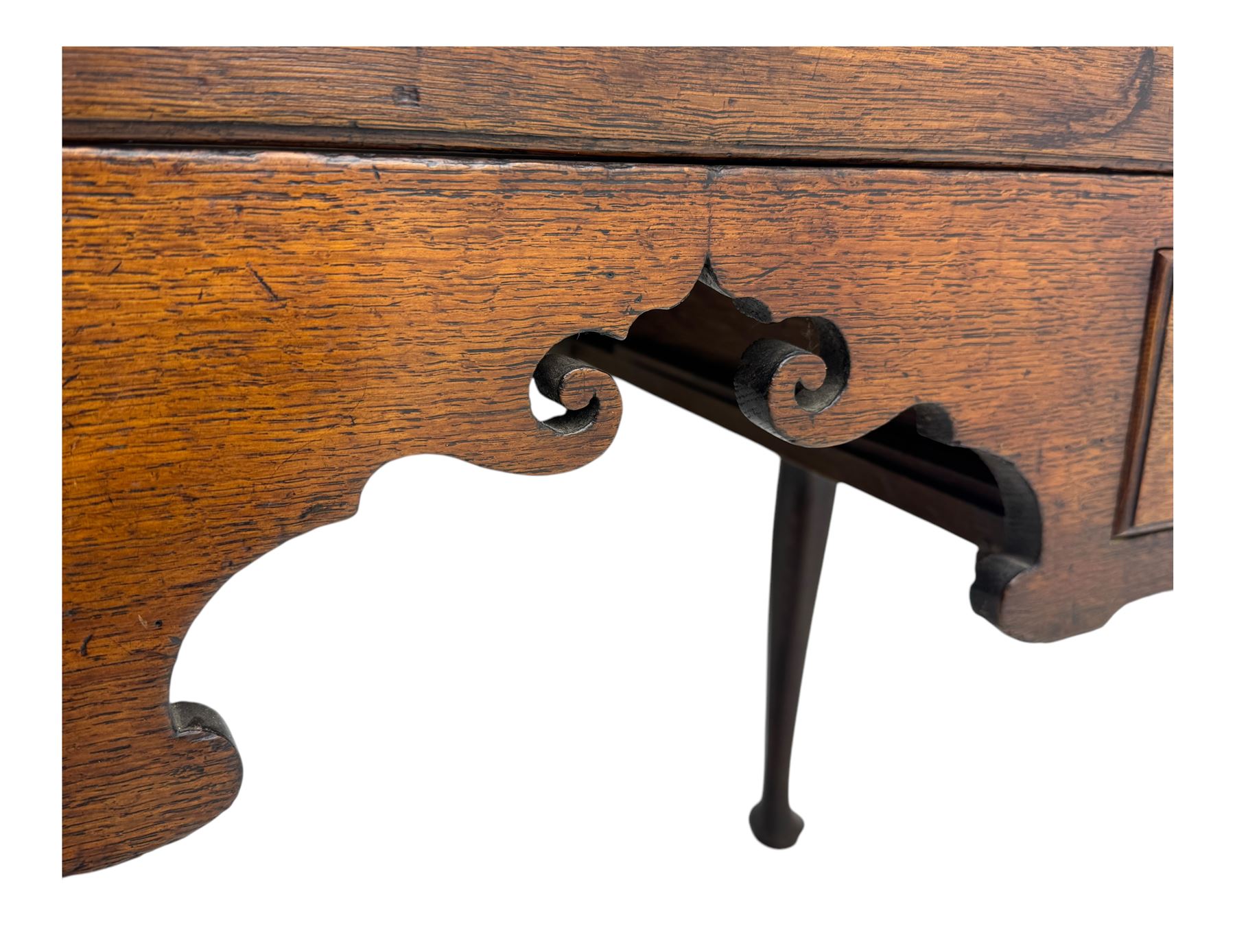 George II oak lowboy, moulded rectangular top over one long and two short drawers fitted with brass drop handles, shaped apron with scrollwork carvings, raised on cabriole supports