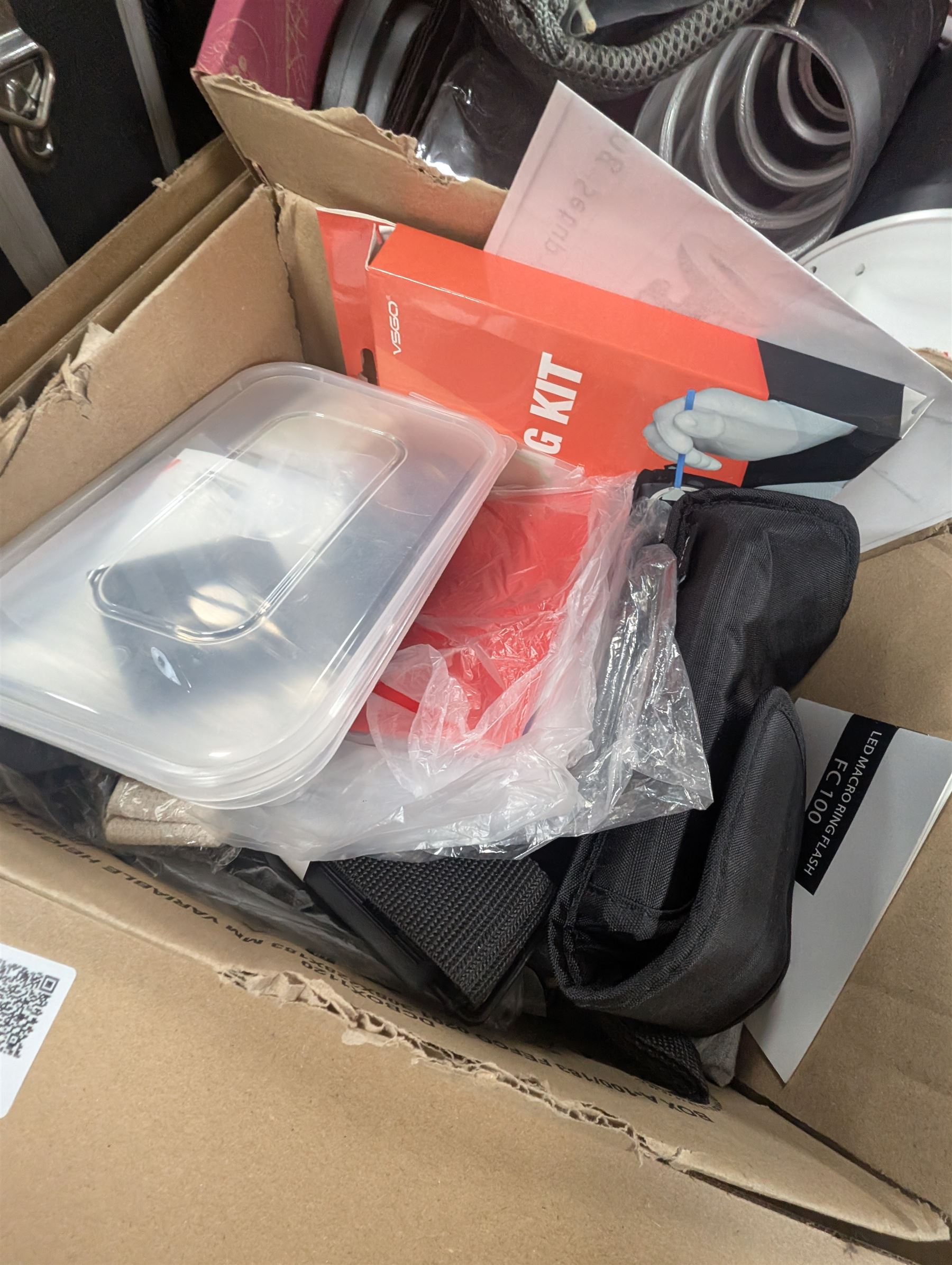 Collection of photography equipment, including flashes, hoods, filters, telephoto lens, bags, etc