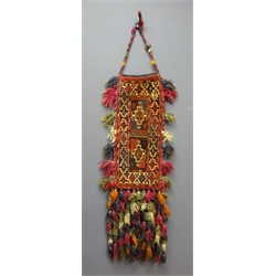  Eastern hand woven saddle bag, having geometric design with woollen tassels, L103cm overall   