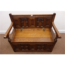  20th century Old Charm oak Monks bench, carved panel back, hinged seat, stile supports, W98cm, H84cm, D47cm  