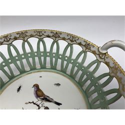 Pair of 19th century German openwork chestnut baskets, with twin handles and scrolling gilt border and star rim, painted to the centre with birds and insects, D22cm 
