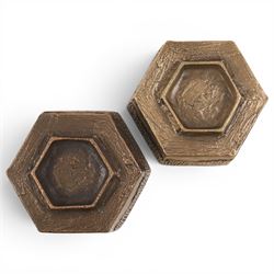 Pair of brutalist candle holders, together with similar wall sconce