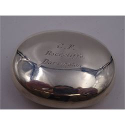 Early 20th century silver squeeze action snuff box, of oval form, engraved verso C.F. Rockcliffe, Darlington, the hinged lid engraved with initials CF and the crests for both Harrow School and Eton College, opening to reveal a gilt interior, hallmarked George Unite, Birmingham 1919, L8cm