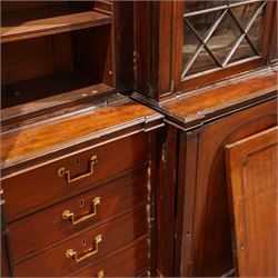 Large Georgian mahogany library bookcase, projecting moulded cornice with row of globular mounts, adjustable shelving enclosed by six astragal glazed doors, fitted with two slides and six panelled cupboard doors, two banks of five drawers, on moulded plinth base; together with two pairs of associated astragal glazed doors in mahogany, from the same property (W55.5cm x H168cm & W48cm x 168cm)
