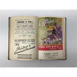 Hull City A.F.C. - two bound volumes of 1940s home match programmes; volume one 1946-7 season containing twenty-six programmes from 31/8/46 to 7/6/47 including Hull City Boys game 5/4/47 against Leicester Boys; volume two 1947-8 season containing twenty-five programmes including Raich Carter's first game 3/4/48 having taken over as player/manager 1/4/48. Uniformly bound in black half leather. Provenance: By direct descent from the family of Raich Carter having been consigned by his daughter Jane Carter.