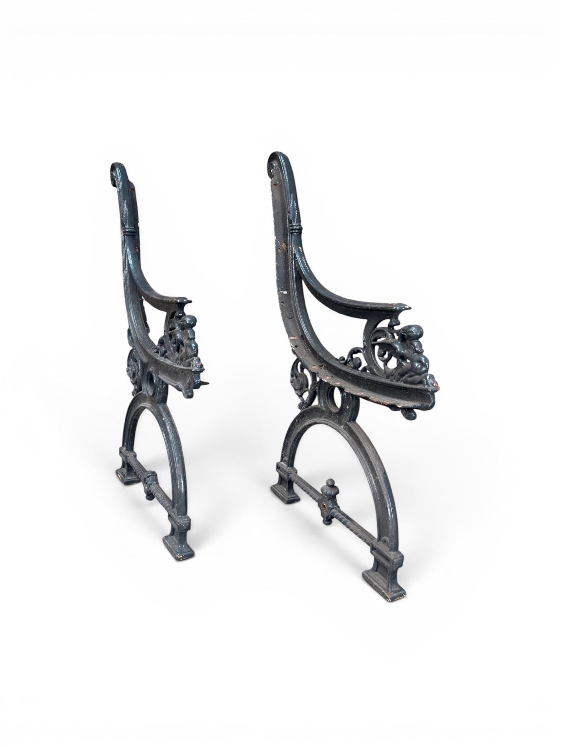 Yates Haywood - pair of 19th century cast iron bench ends, winged griffin detail, arched legs with rope turned decoration, finish in green paint, registration number 206550, first registered 8 March 1867 (see illustration), length as required