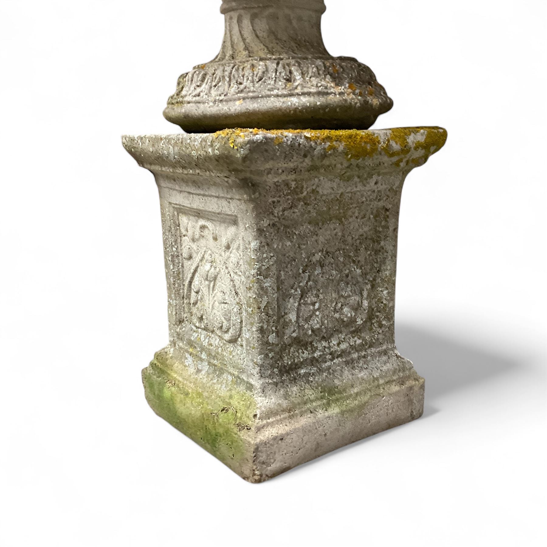 Pair of cast stone ornate garden urns, on plinth bases