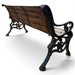 Late 19th/early 20th century Coalbrookdale design cast iron and teak garden bench, the end supports with scrolled backs and pierced foliate arm terminals above ornate scrolling acanthus-cast stretchers, terminating in lobed pad feet, united by a teak slatted back and seat