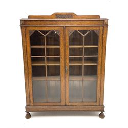 19th century oak display cabinet, two glazed doors enclosing three adjustable shelves, raised on turned on turned supports 