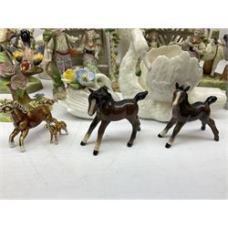 Group of animal figures to include two Beswick bay foals,  J.T Jones for Crown Staffordshire figure group of bird upon a branch, two donkey figure groups in the style of Royal Dux (a/f), pheasant figure, pair of Stafforsdhire style dogs, other figures