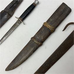  British Private Purchase fighting knife by William Rodgers, Sheffield, the 15cm double edge steel blade with raised medial ridge, stamped on one side of the ricasso WILLIAM RODGERS I CUT MY WAY, the opposing side marked MADE IN SHEFFIELD, ENGLAND, with aluminium crossguard and pommel, stacked leather washers grip and leather scabbard L27.5cm overall; and a crudely made short sword with 32.5cm single edged blade and steel knucklebow hilt with hardwood grip; in cane bound wooden scabbard L45cm overall (2)