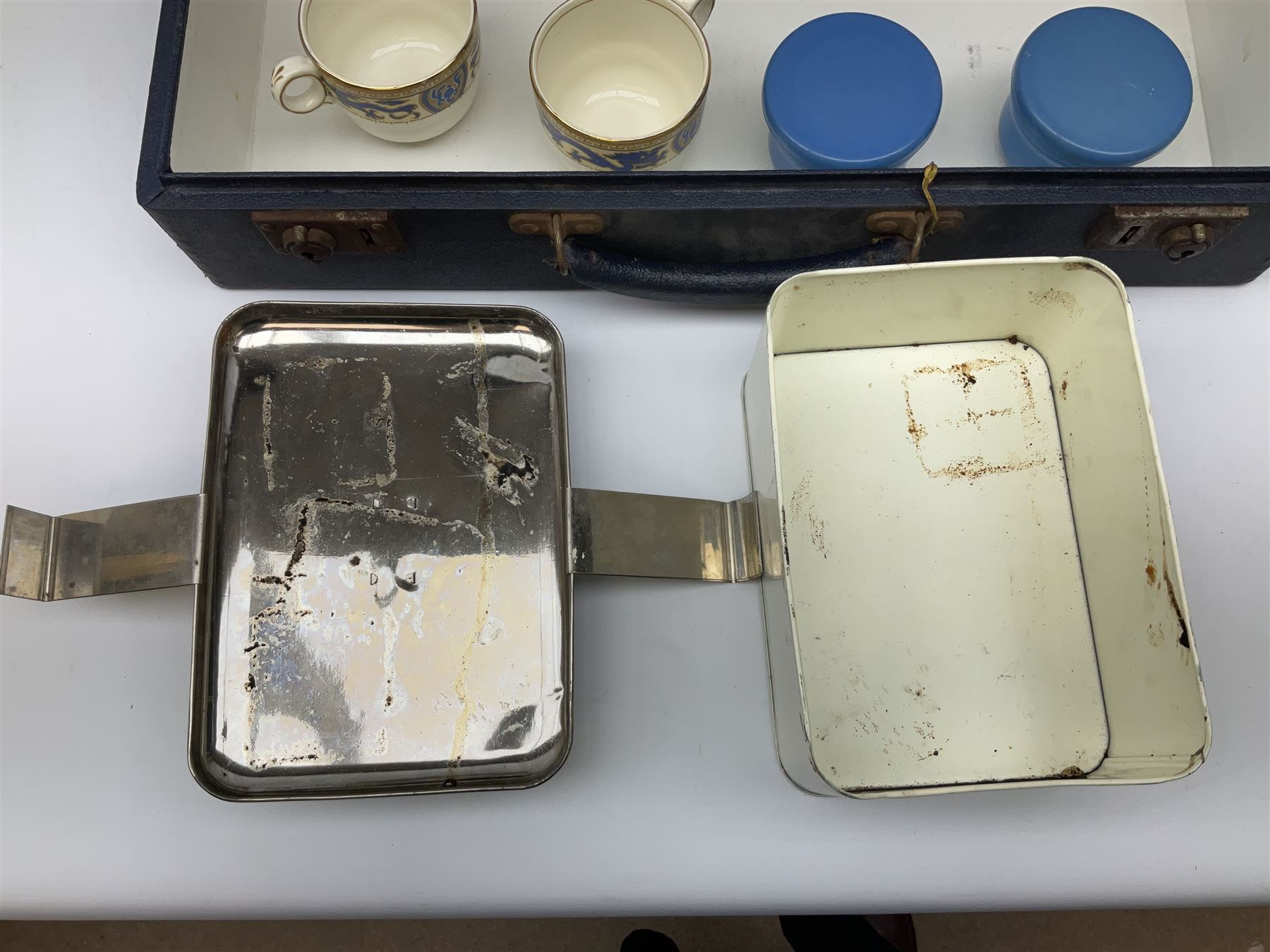 Vintage Harlequin picnic case, with tin sandwiches boxe, ceramic cups, plates, bowls and flatware for four settings, L48cm, H30cm