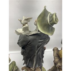 Three Capodimonte figures, to include The Kind Heart Man, modelled by Cortese as a tramp with two doves, The Young Falconer by Maria Angela and another modelled as a tramp darning his socks, all with printed marks, tallest H39cm