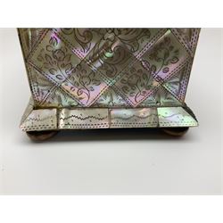 Victorian mother of pearl tea caddy, of rectangular bow-fronted form, the body with floral, bird and geometric engraved mother of pearl panels, white metal shield plaque to the cover inscribed with the initials G.J.A and similar escutcheon, the two division interior with ivory edging and two panelled mother of pearl lids, on four vegetable ivory bun feet L20cm, together with a similar style mother of pearl card case (2) This item has been registered for sale under Section 10 of the APHA Ivory Act