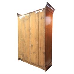 Aesthetic Movement walnut parcel gilt wardrobe, the crenellated top, above central mirrored door opening to reveal hanging space, four opened and two closed draws