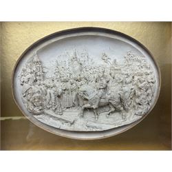 Justin Mathieu, two oval high relief plaque depicting a battle scenes, each within a wooden frame, frame  H21cm, L25cm