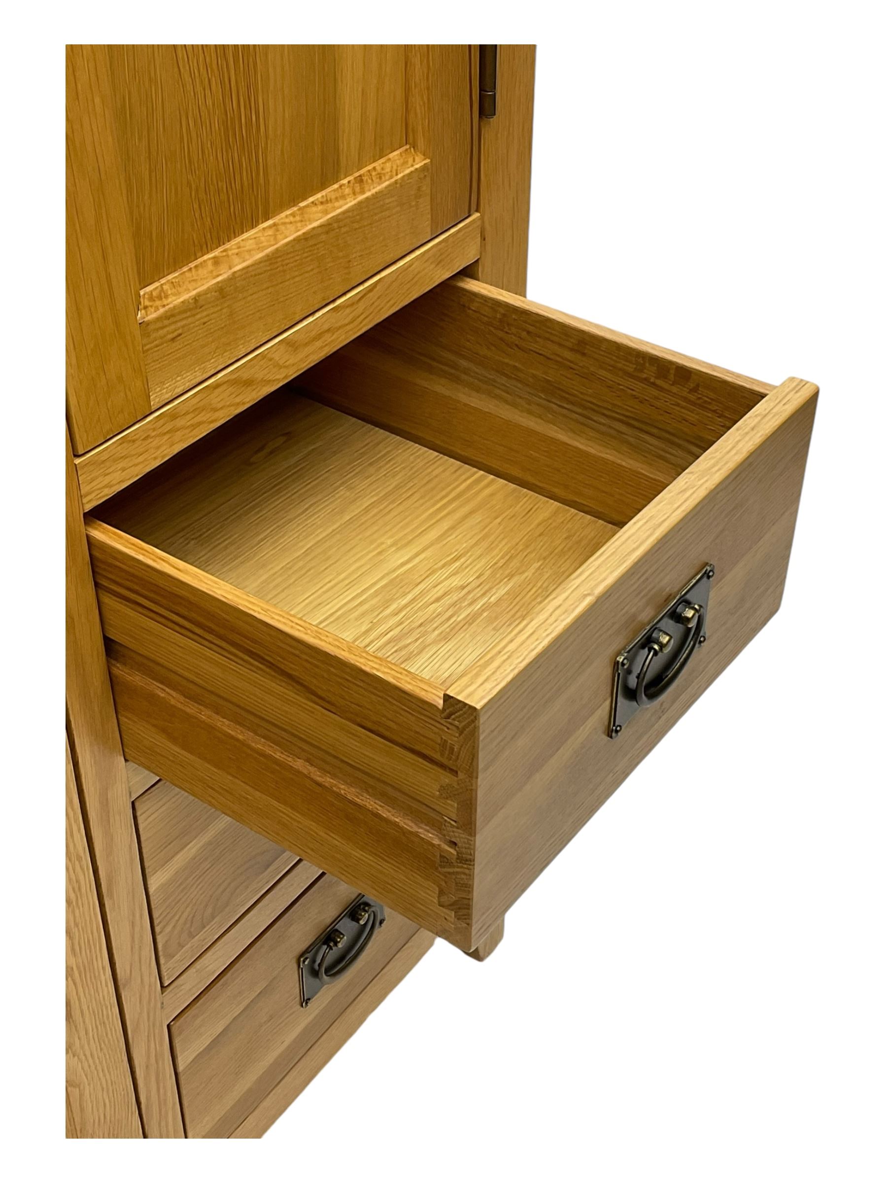 Light oak combination wardrobe, fitted with full-height compartment, single cupboard and three small drawers