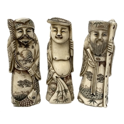 Three 19th century Japanese Meiji bone okimonos, modelled as scholars with staffs, H10cm, (3)  