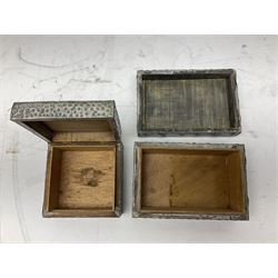 Arts & Crafts style hammered pewter box the lid with applied cabochon, together two other similar examples and a fourth pewter box embossed with flowers, tallest example H9.5cm