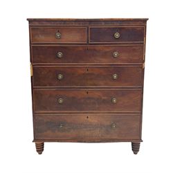 Early 19th century figured mahogany chest, fitted with two short and four long drawers, turned feet