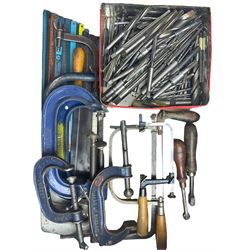 Assortment of hacksaw blades, various different sized Record G clamps, lathe reamers and various wood saws, piercing saw, fret saw and hack saws, with two hand knurling tools.