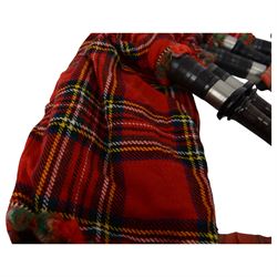 Set of mid 20th century bagpipes, with McLeod chanter, Royal Stuart cover, tassels, ribbons and spare accessories, contained within a wooden carry case, together with a Scarborough Highland Pipe Band uniform, comprising black highland dress jacket, Royal Stuart kilt, Glen Garry hat, Swinging Six sporren, Sgian Dubh knife, piper's dirk with knife and fork, etc