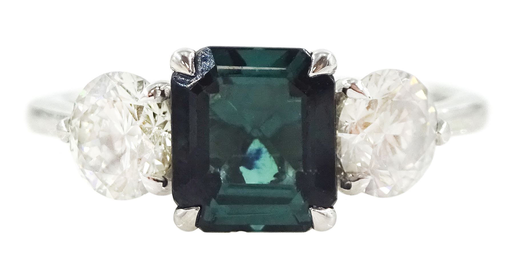 Platinum tourmaline and diamond three stone ring, single octagonal cut green tourmaline of approx 1.65 carat, with a round brilliant cut diamond set either side, stamped PT 950, total diamond weight approx 1.05 carat