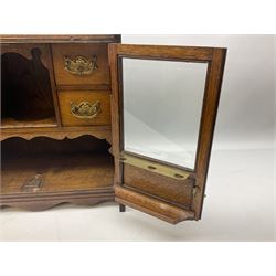 Oak smokers cabinet, twin glazed doors enclosing four small drawers and a pipe rack, H46cm