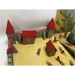 Compositional wooden toy castle, enclosed within a box with chromolithographic printed paper of a forest, with painted metal soldiers; box H34cm, W50cm  