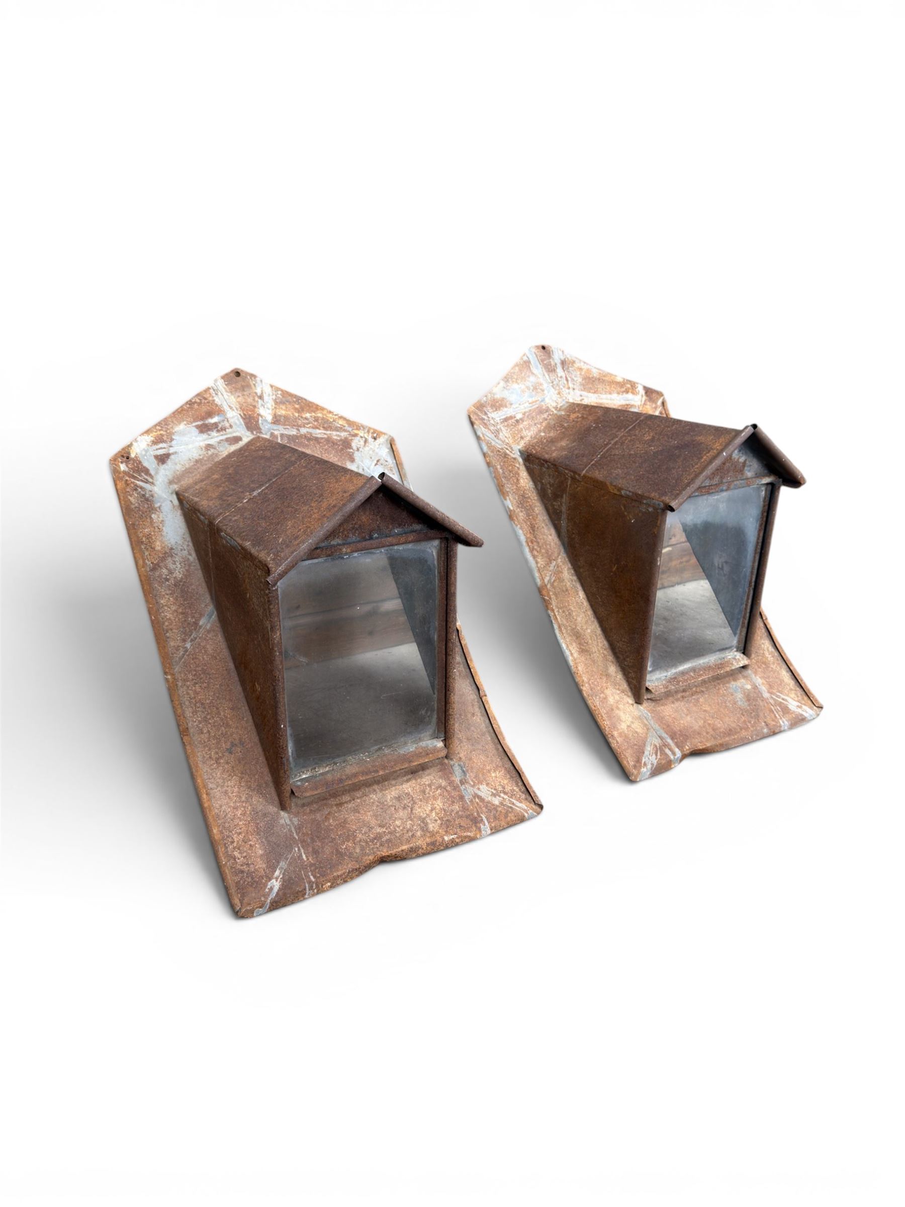 Pair of metal sloping roof lanterns with glazed windows
