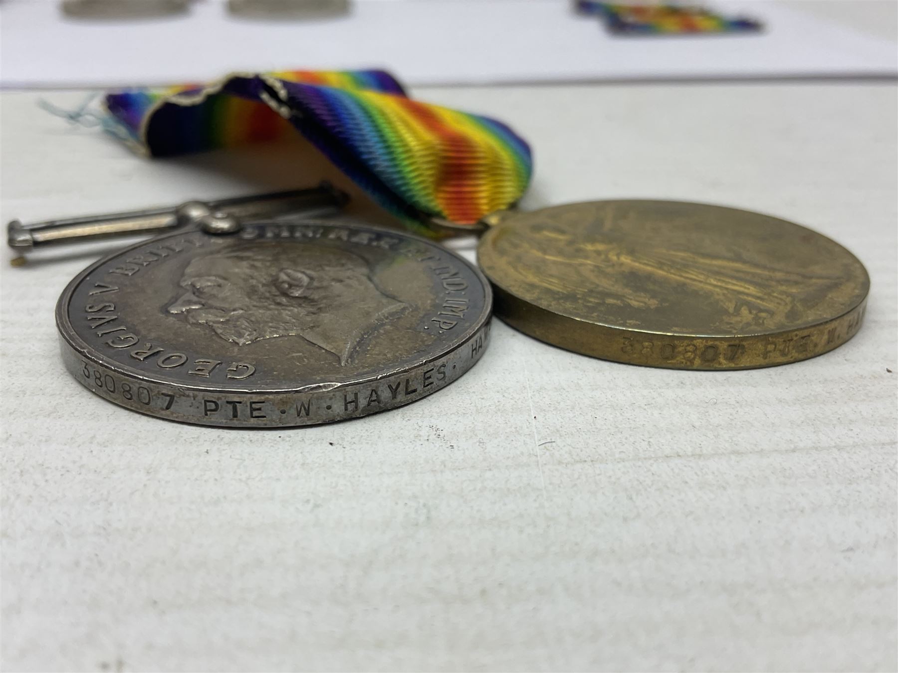 WWI pair of medals comprising British War Medal and Victory Medal awarded to 380807 Pte. W. Hayles Hamps. R.; Imperial Service Medal awarded to William Hayles; cased and boxed; WWII 1939-1945 War Medal and Defence Medal in issue box with slip; 1930s hallmarked silver football presentation fob etc