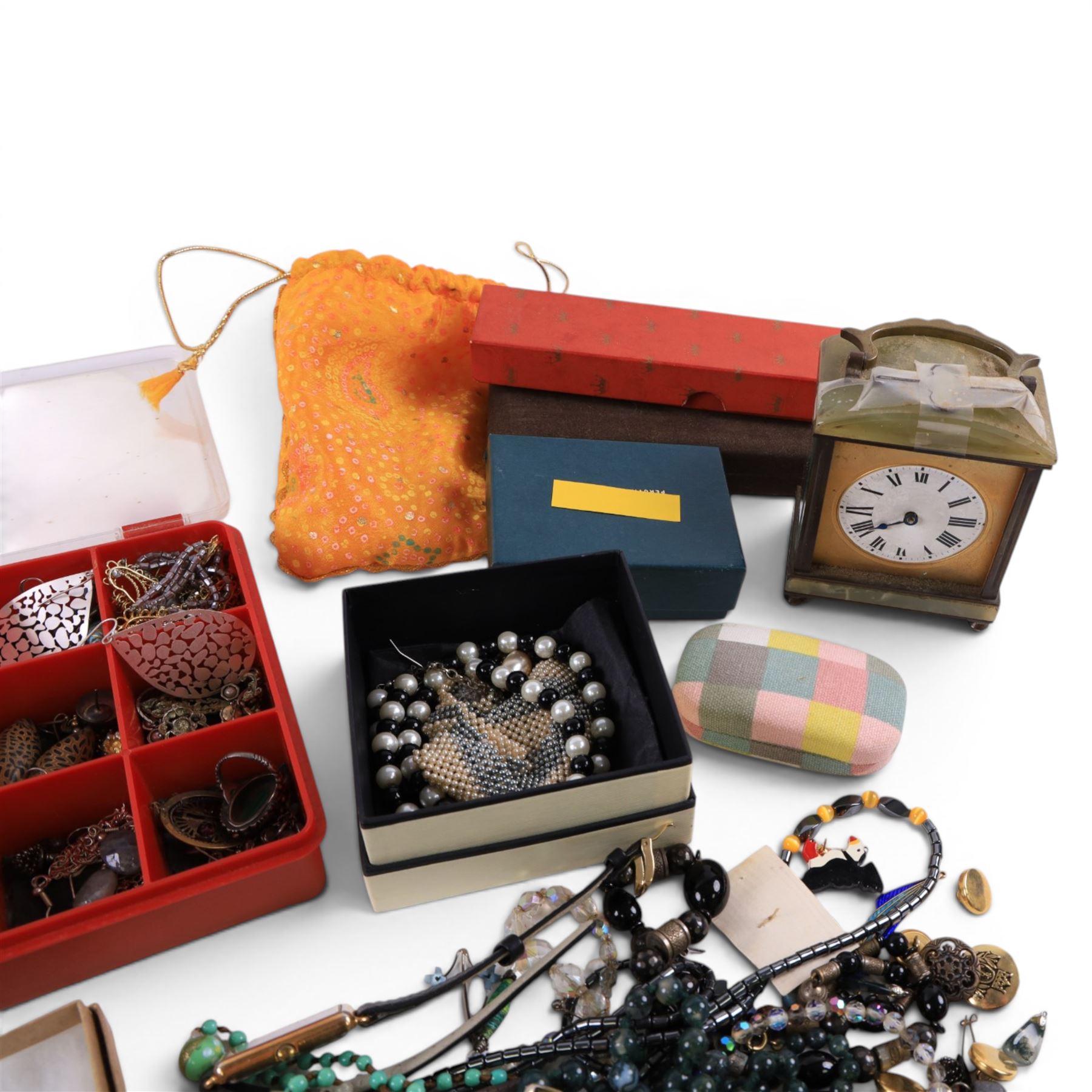 Collection of silver and costume jewellery, including earrings, brooches, beaded necklaces, Onyx table clock, wristwatches, etc
