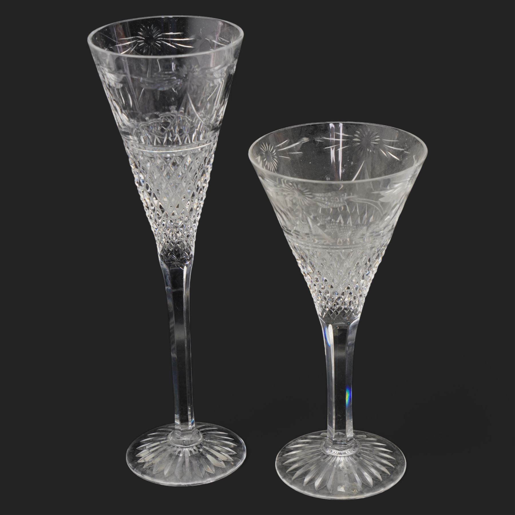 Stuart crystal 'Beaconsfield' pattern drinking glasses comprising twelve wine glasses and four champagne flutes (16)